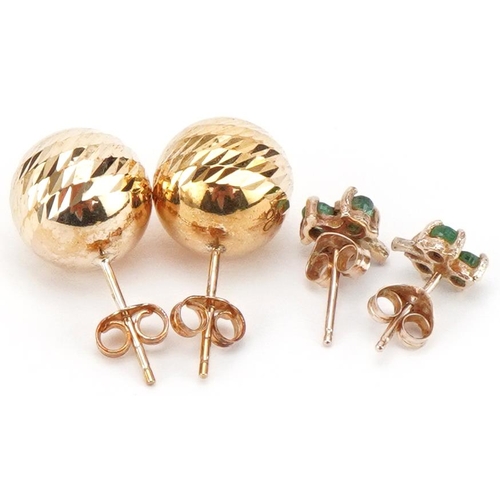 3407 - Two pairs of 9ct gold earrings including pair set with emeralds, the largest 10mm in diameter, total... 