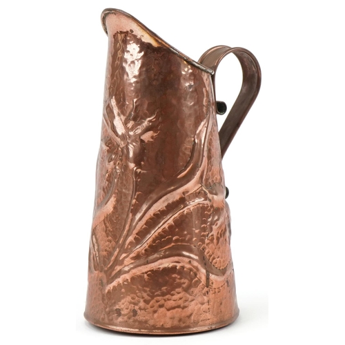 126 - Arts & Crafts copper jug decorated with daffodils, 27cm high