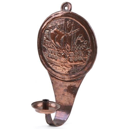 255 - Arts & Crafts copper candle wall sconce decorated with a Galleon, 50cm high