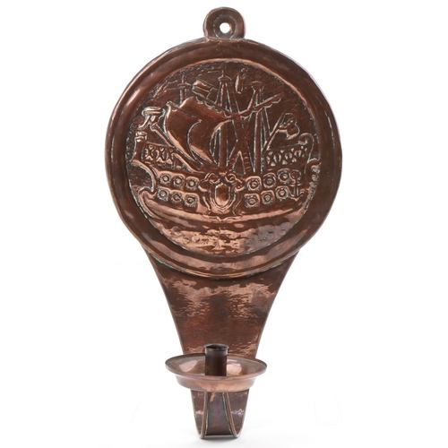 255 - Arts & Crafts copper candle wall sconce decorated with a Galleon, 50cm high