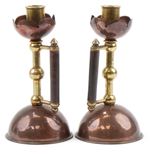 21 - Pair of Christopher Dresser design W.A.S Benson Arts & Crafts copper and brass candlesticks, each 19... 