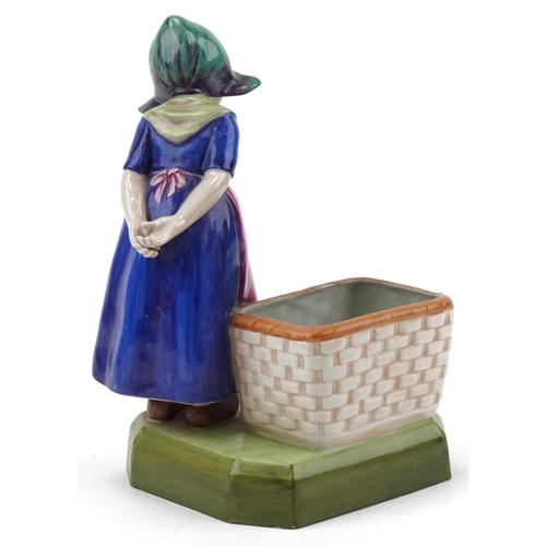 474 - Royal Dux Czechoslovakia figurine of a Dutch girl with basket, numbered 3111 to the base, 25cm high