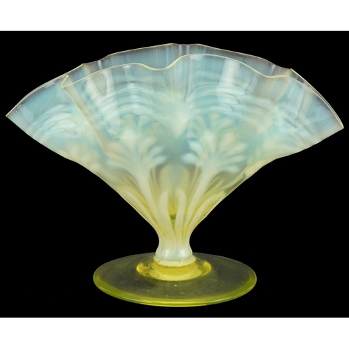 282 - Vaseline glass vase on a stemmed base, 16cm high