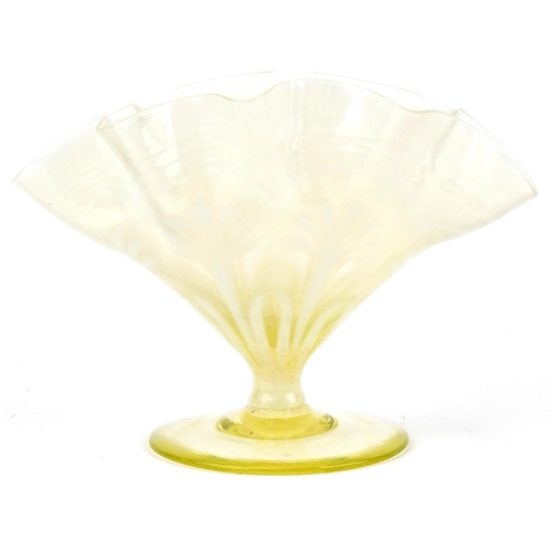 282 - Vaseline glass vase on a stemmed base, 16cm high