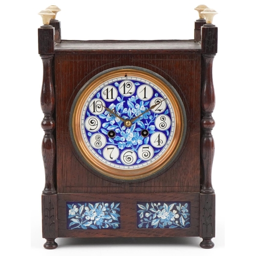 160 - Arts & Crafts oak mantle clock inset with floral enamelled porcelain tiles, the French movement stri... 