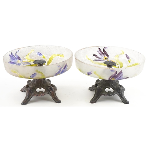 512 - Pair of Art Nouveau pewter and glass tazzas hand painted with lilies, 21cm in diameter