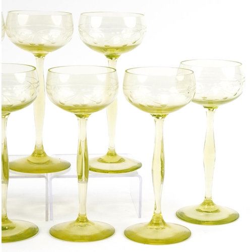 527 - Eleven stylish lime green stemmed wine glasses etched with berries, 18cm high