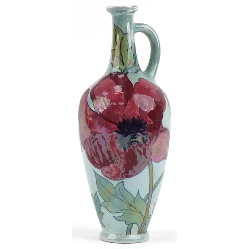 208 - Charlotte Rhead for Bursley Ware red lustre poppy ewer, 34cm high