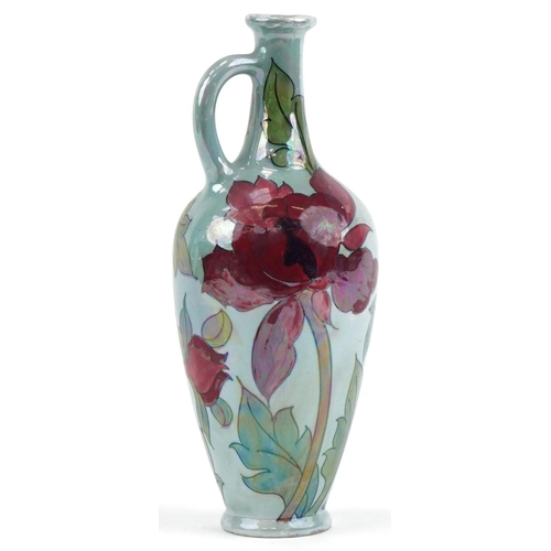 208 - Charlotte Rhead for Bursley Ware red lustre poppy ewer, 34cm high