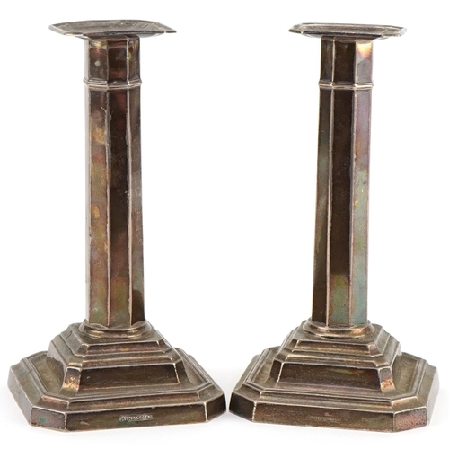 1127 - James Dixon & Sons Ltd, a pair of George V octagonal silver candlesticks, Sheffield 1919, 16.5cm hig... 