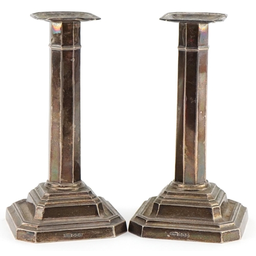 1127 - James Dixon & Sons Ltd, a pair of George V octagonal silver candlesticks, Sheffield 1919, 16.5cm hig... 