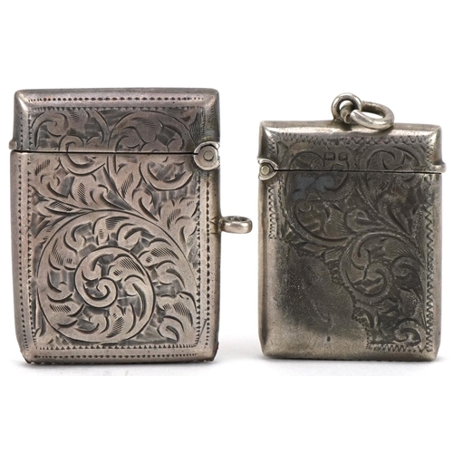 1244 - Two Edwardian and later silver vestas with engraved floral decoration, the largest 4.2cm high, total... 