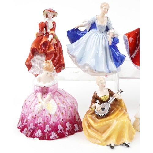 2114 - Nine Royal Doulton figurines including Karen HN2388, Top of the Hill HN4778 and Victoria HN2471, the... 