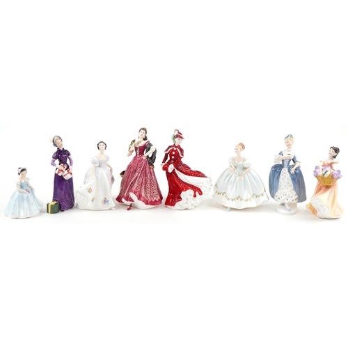 2115 - Eight Royal Doulton porcelain figurines including Kate HN2789, Christmas Day HN4552 and Carmen HN399... 