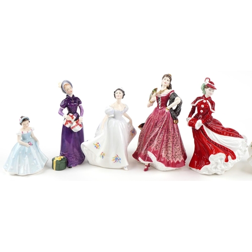 2115 - Eight Royal Doulton porcelain figurines including Kate HN2789, Christmas Day HN4552 and Carmen HN399... 