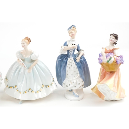 2115 - Eight Royal Doulton porcelain figurines including Kate HN2789, Christmas Day HN4552 and Carmen HN399... 