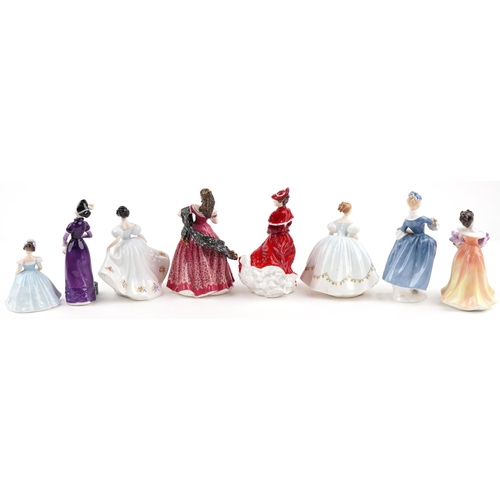 2115 - Eight Royal Doulton porcelain figurines including Kate HN2789, Christmas Day HN4552 and Carmen HN399... 