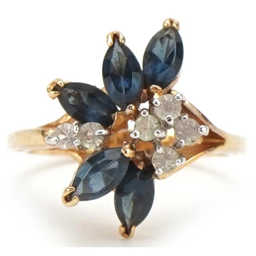 3234 - Yellow metal blue and clear stone floral ring, size K, 2.4g