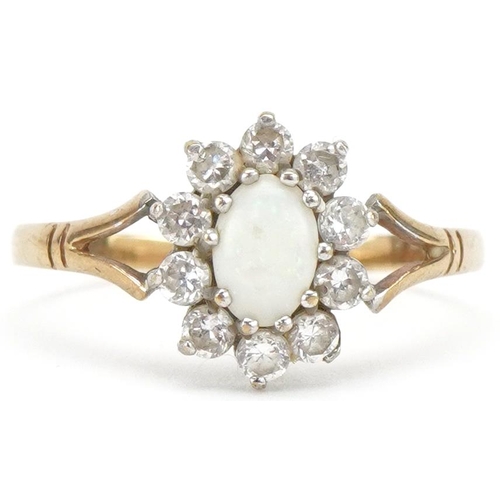 3231 - Unmarked gold cabochon opal and clear stone cluster ring with split shoulders, size R, 1.6g