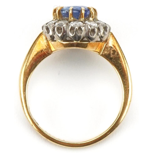 3007 - 18ct gold sapphire and diamond cluster ring, the sapphire approximately 8.70mm x 6.10mm x 4.10mm dee... 