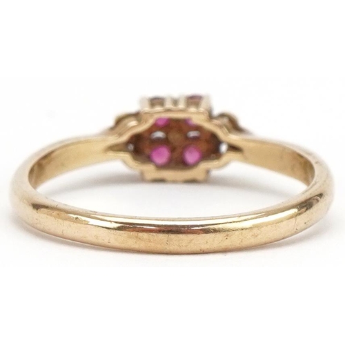 3287 - 9ct gold ruby cluster ring with scrolled shoulders, size L/M, 1.8g