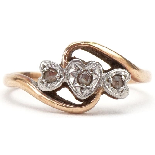 3139 - 9ct gold diamond love heart crossover ring set with three diamonds, size I/J, 1.9g