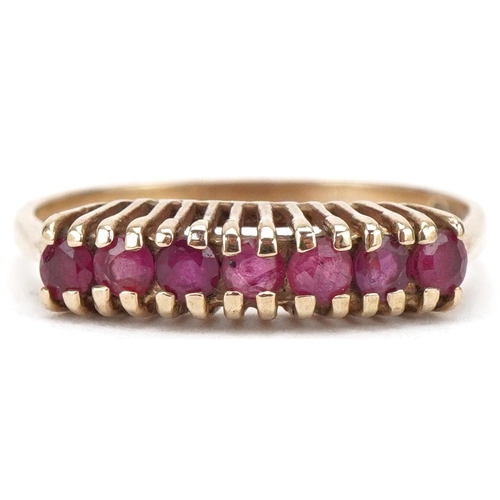 3204 - 9ct gold ruby half eternity ring, size L/M, 1.6g