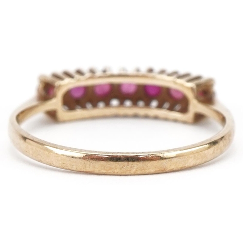 3204 - 9ct gold ruby half eternity ring, size L/M, 1.6g