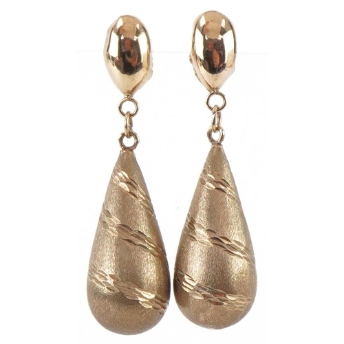 3474 - Pair of yellow metal engine turned teardrop earrings, each 3.5cm high, total 1.5g