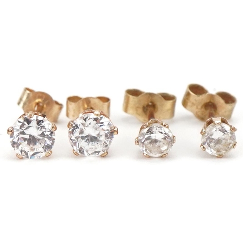 3526 - Two pairs of 9ct gold clear stone stud earrings, the largest 4.4mm in diameter, total 0.6g