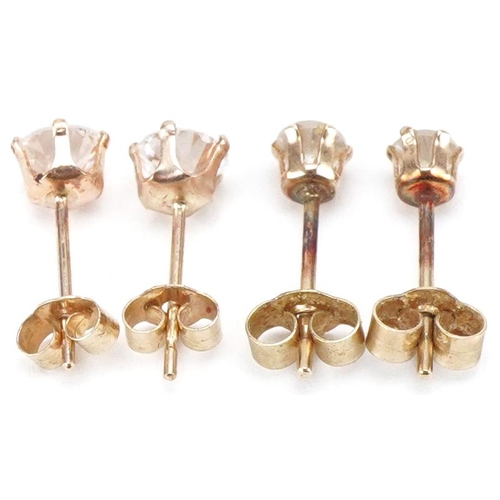 3526 - Two pairs of 9ct gold clear stone stud earrings, the largest 4.4mm in diameter, total 0.6g