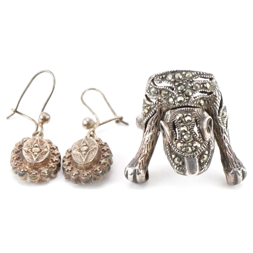 3507 - Silver marcasite ring in the form of a tiger and a pair of Victorian white metal drop earrings, the ... 