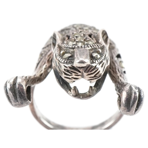 3507 - Silver marcasite ring in the form of a tiger and a pair of Victorian white metal drop earrings, the ... 