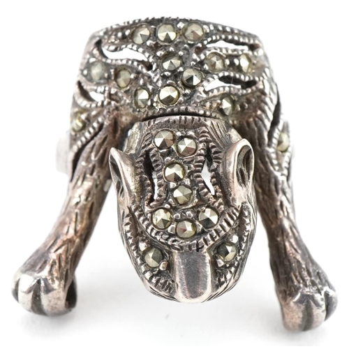 3507 - Silver marcasite ring in the form of a tiger and a pair of Victorian white metal drop earrings, the ... 