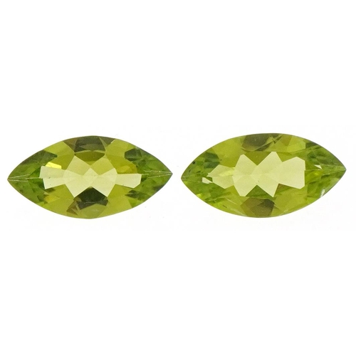 3153 - Two marquis cut peridots, the largest approximately 14.0mm x 7.10mm x 4.20mm deep