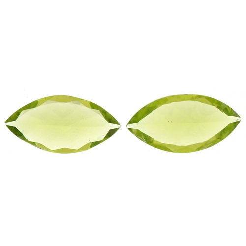 3153 - Two marquis cut peridots, the largest approximately 14.0mm x 7.10mm x 4.20mm deep