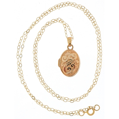 3484 - 9ct gold floral engraved locket on a 9ct gold necklace, the locket 1.9cm high, total 1.2g