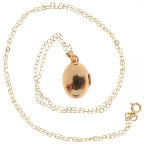 3484 - 9ct gold floral engraved locket on a 9ct gold necklace, the locket 1.9cm high, total 1.2g