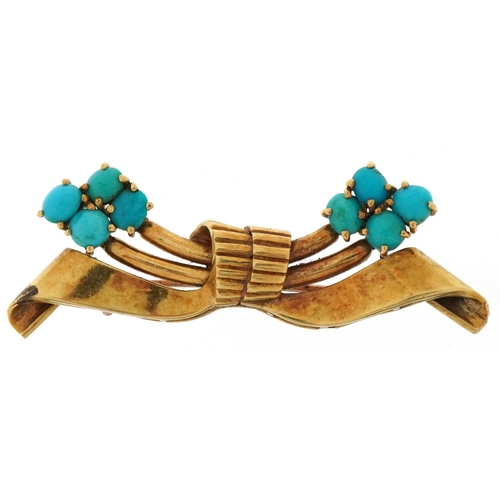 3002 - Gazdar, unmarked gold cabochon turquoise brooch in the form of a bow, tests as 14ct gold, 6.5cm wide... 