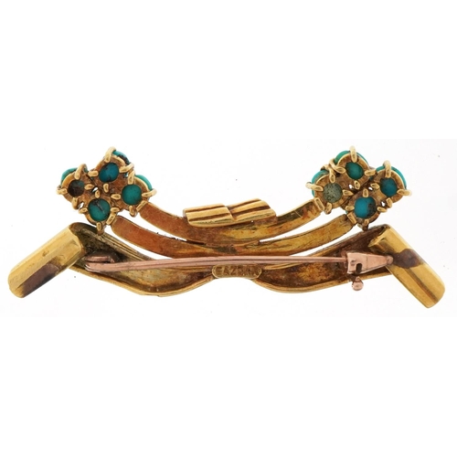 3002 - Gazdar, unmarked gold cabochon turquoise brooch in the form of a bow, tests as 14ct gold, 6.5cm wide... 