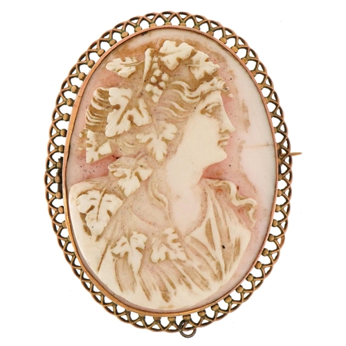 3005 - Unmarked gold cameo shell brooch carved with a maiden head, 5cm high, 15.0g