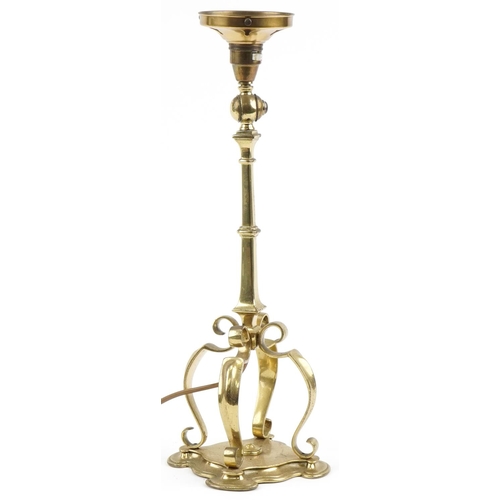 73 - Arts & Crafts brass lamp with stylized base, 43cm high