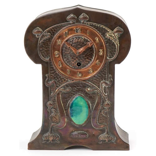 10 - Liberty Arts & Crafts stylized copper clock inset with a oval Ruskin cabochon, 34cm high