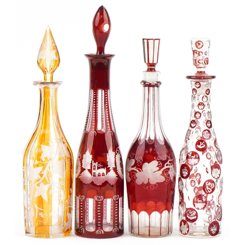 1277 - Four Victorian etched overlaid decanters, the largest 41cm high