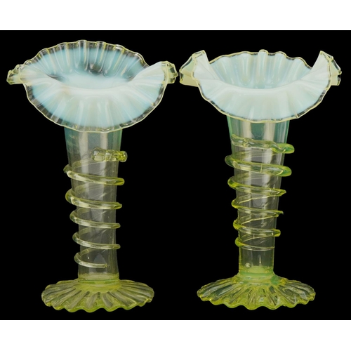 288 - Two Vaseline glass vases with frilled tops, the largest 22cm high