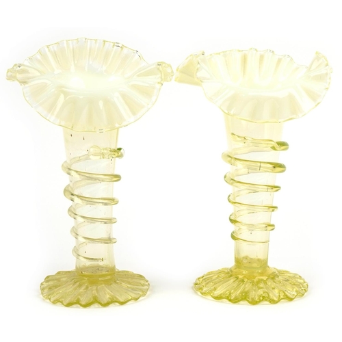 288 - Two Vaseline glass vases with frilled tops, the largest 22cm high