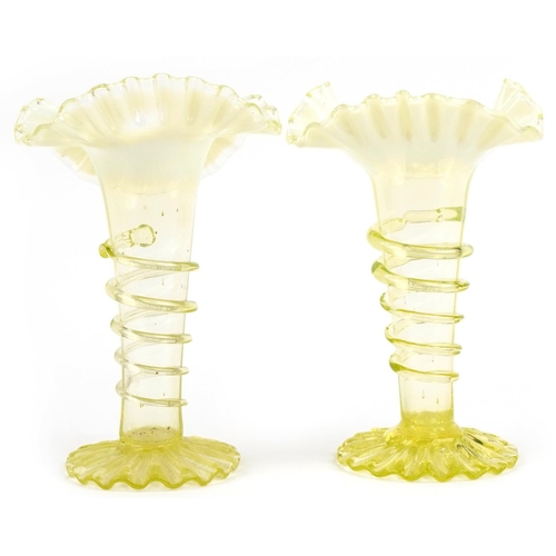 288 - Two Vaseline glass vases with frilled tops, the largest 22cm high