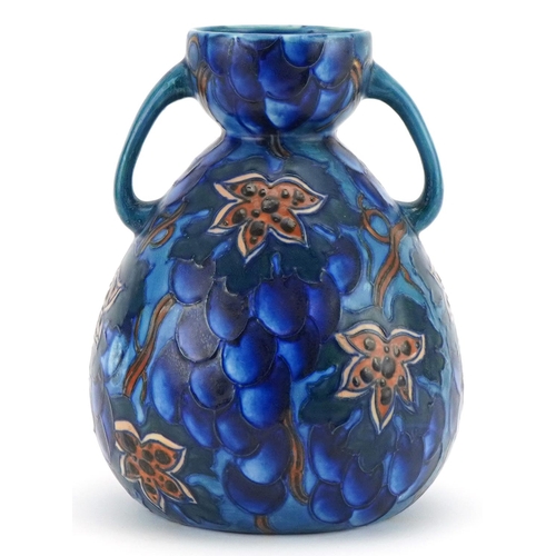 296 - Charlotte Rhead for Bursley Ware Blue Grape design twin handled vase numbered 585 to the base, 20cm ... 