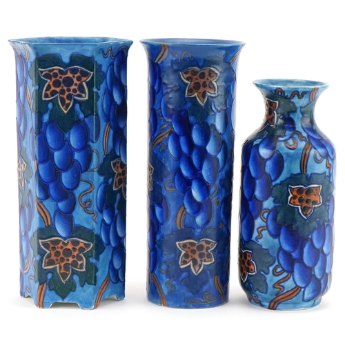 299 - Three Charlotte Rhead for Bursley Ware Blue Grape design vases, numbered 585 to the bases, the large... 