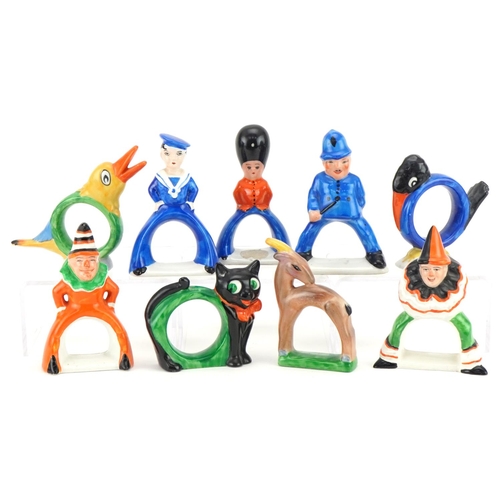 423 - Carlton Ware novelty napkin rings including sailor boy, policeman, guardsman, clown and duck, the la... 